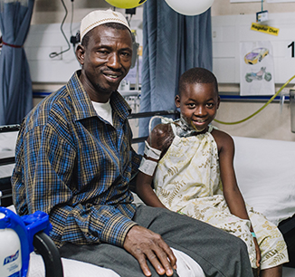 Drissa with his father, Mory, after surgery